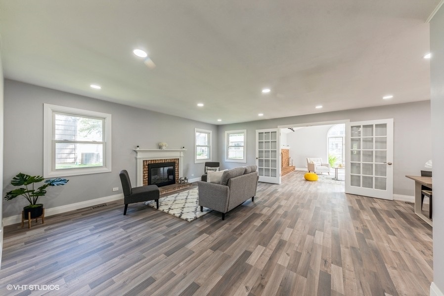 135 Timber Hill Road Buffalo Grove, IL 60089 - Photo 4 of 22 a living room with furniture and a fireplace