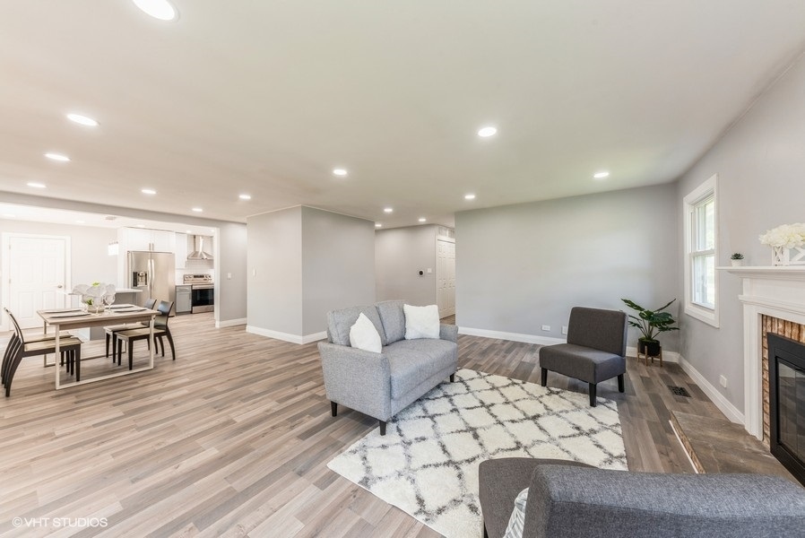 135 Timber Hill Road Buffalo Grove, IL 60089 - Photo 5 of 22 a living room with furniture and a wooden floor