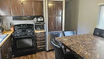 a kitchen with a stove and a refrigerator