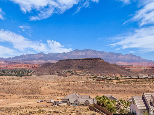 1620 Belayer Drive St. George, UT 84770 - Photo 51 of 51 Expansive desert landscape featuring distant mountains, red rock formations, and a clear blue sky