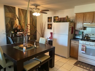 4819 West Engle Road, Unit 3A Alsip, IL 60803 - Photo 8 of 20 a kitchen with a dining table and chairs