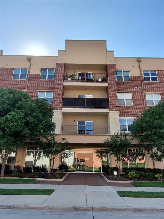 1100 West Trinity Mills Road, Unit 3032 Carrollton, TX 75006 - Photo 2 of 31 a view of a building with a street