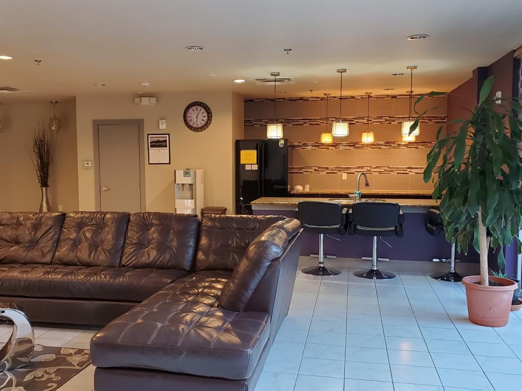 1100 West Trinity Mills Road, Unit 3032 Carrollton, TX 75006 - Photo 23 of 31 a living room with furniture and a large window