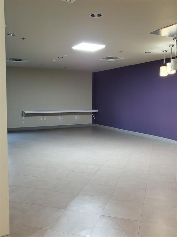 1100 West Trinity Mills Road, Unit 3032 Carrollton, TX 75006 - Photo 24 of 31 an empty room with a workbench