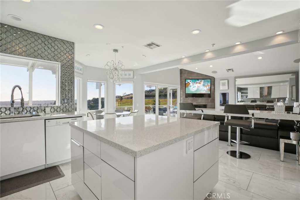 3 Via Pasa San Clemente, CA 92673 - Photo 16 of 55 a kitchen with sink and center island