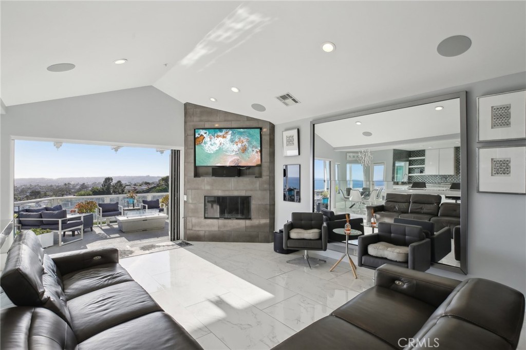 3 Via Pasa San Clemente, CA 92673 - Photo 19 of 55 a living room with fireplace furniture and a flat screen tv