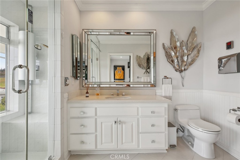 3 Via Pasa San Clemente, CA 92673 - Photo 39 of 55 a bathroom with a granite countertop sink a toilet and a mirror