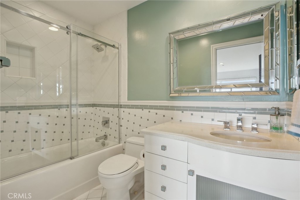 3 Via Pasa San Clemente, CA 92673 - Photo 43 of 55 a bathroom with a sink a toilet and a mirror