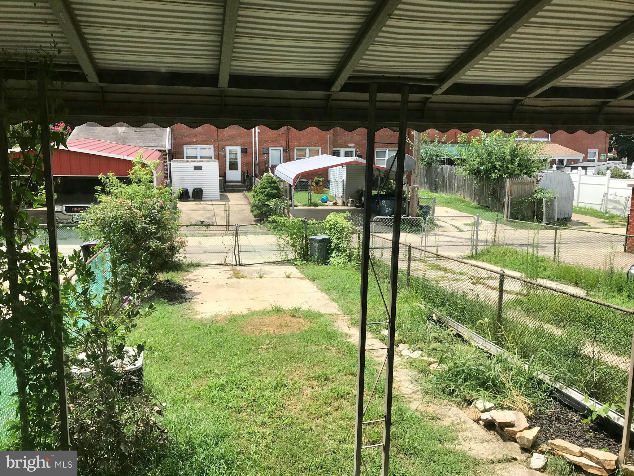 8167 Gray Haven Road Baltimore, MD 21222 - Photo 13 of 16 REAR YARD w/PARKING PAD & CAR GATE