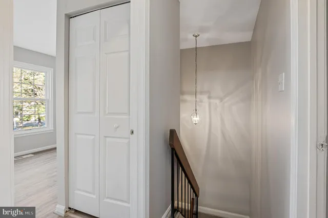a view of a hallway with windows