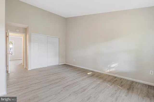 a view of an empty room and wooden floor
