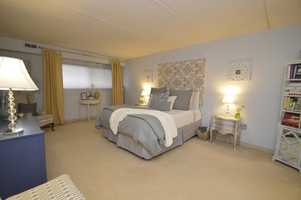 146 Marble Street, Unit 211 Stoneham, MA 02180 - Photo 11 of 20 a bedroom with a bed and a couch