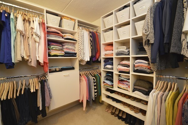 146 Marble Street, Unit 211 Stoneham, MA 02180 - Photo 13 of 20 a view of walk in closet with clothes and shoes