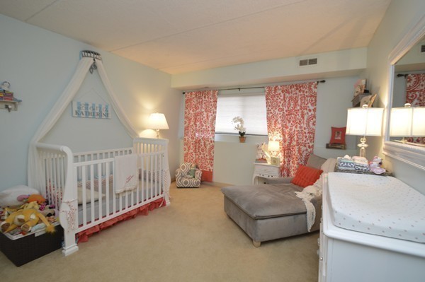 146 Marble Street, Unit 211 Stoneham, MA 02180 - Photo 16 of 20 a living room with furniture and a table