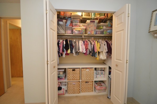 146 Marble Street, Unit 211 Stoneham, MA 02180 - Photo 17 of 20 a view of walk in closet with clothes and shoes