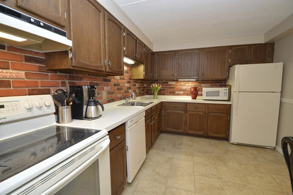 146 Marble Street, Unit 211 Stoneham, MA 02180 - Photo 2 of 20 a kitchen with a sink a stove and cabinets