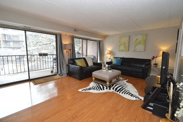 146 Marble Street, Unit 211 Stoneham, MA 02180 - Photo 4 of 20 a living room with furniture fireplace and a large window