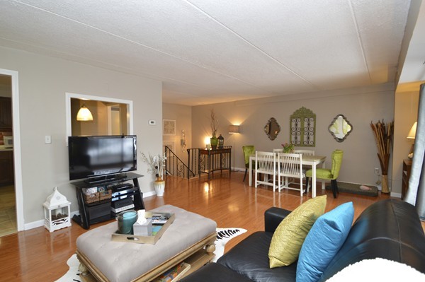 146 Marble Street, Unit 211 Stoneham, MA 02180 - Photo 6 of 20 a living room with furniture and a flat screen tv