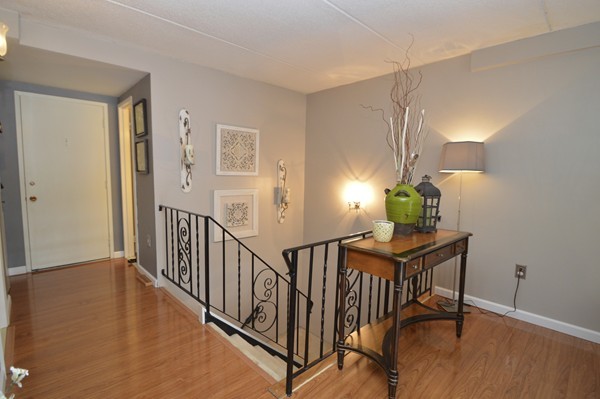 146 Marble Street, Unit 211 Stoneham, MA 02180 - Photo 10 of 20 a view of entryway with wooden floor
