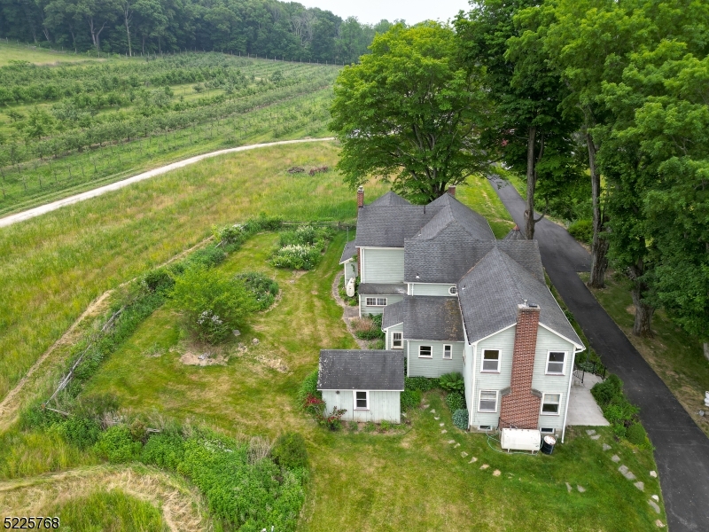 a aerial view of a house with a yard