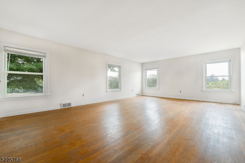 131 Karrville Road Port Murray, NJ 07865 - Photo 14 of 23 an empty room with wooden floor and windows