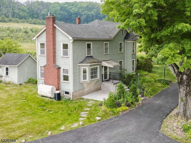 131 Karrville Road Port Murray, NJ 07865 - Photo 2 of 23 a front view of a house with garden