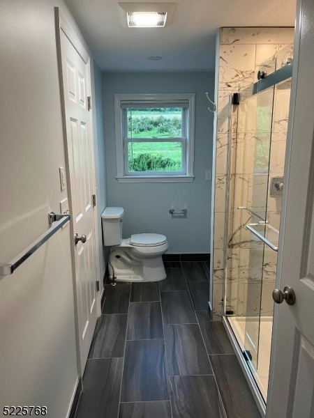 131 Karrville Road Port Murray, NJ 07865 - Photo 22 of 23 a bathroom with a sink a toilet and a shower
