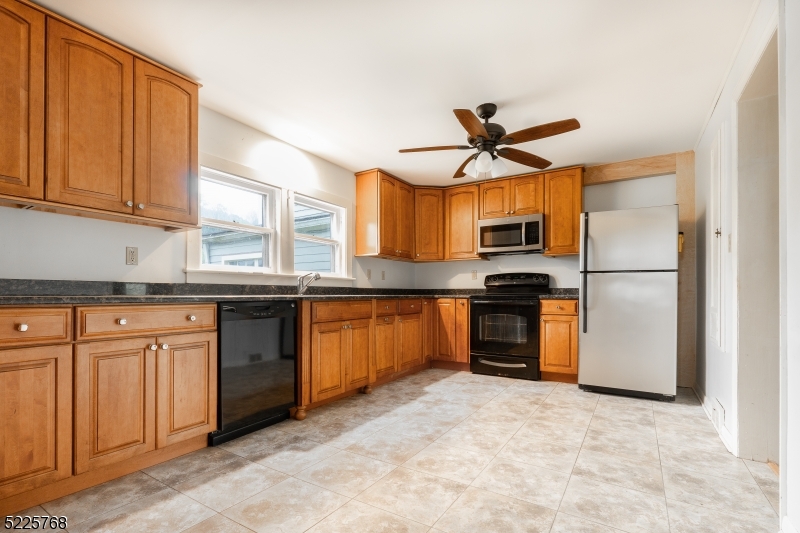 131 Karrville Road Port Murray, NJ 07865 - Photo 5 of 23 a kitchen with stainless steel appliances granite countertop a refrigerator a stove a sink and dishwasher