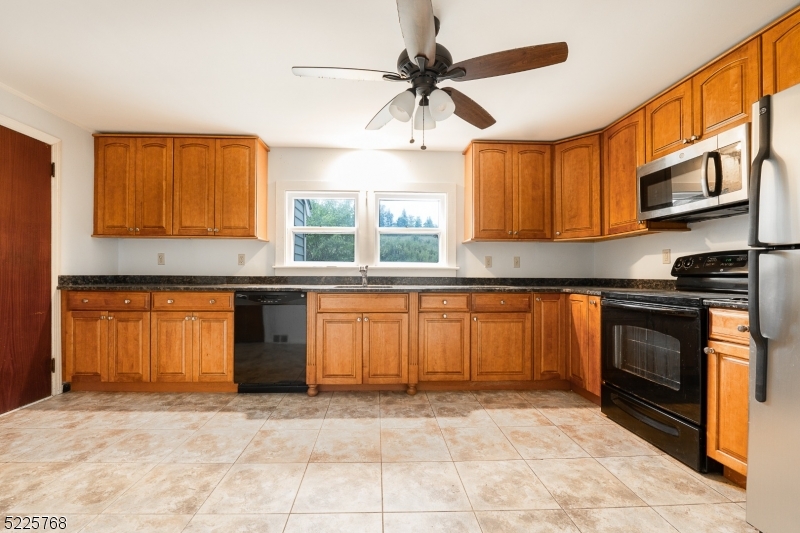 131 Karrville Road Port Murray, NJ 07865 - Photo 7 of 23 a kitchen with stainless steel appliances granite countertop a stove sink and cabinets