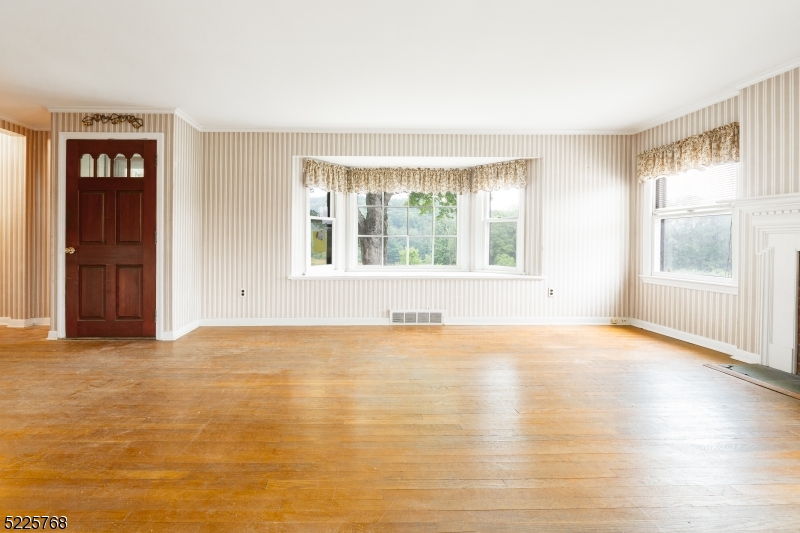 131 Karrville Road Port Murray, NJ 07865 - Photo 8 of 23 a view of an empty room with wooden floor and a window