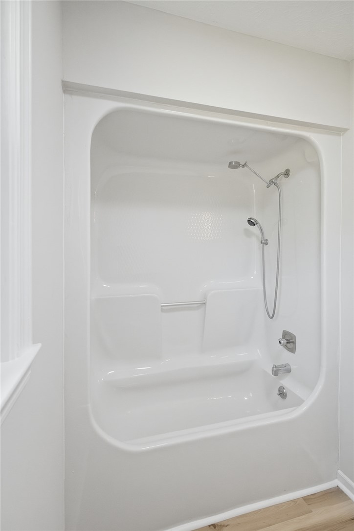 902 Cherokee Road Pelzer, SC 29669 - Photo 15 of 38 A pristine, all-in-one shower and tub combination awaits in this well-appointed bathroom.