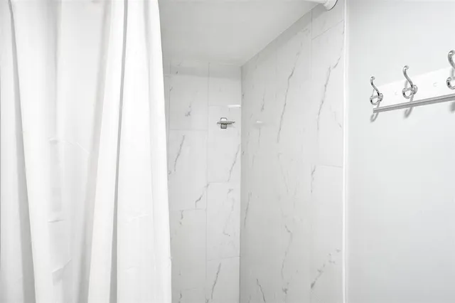 a living room with furniture a couch and a flat screen tv