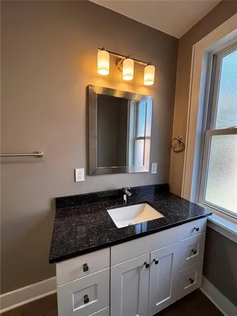 a bathroom with a toilet and a bathtub