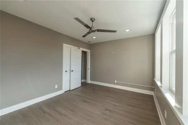 a view of a house with a small deck