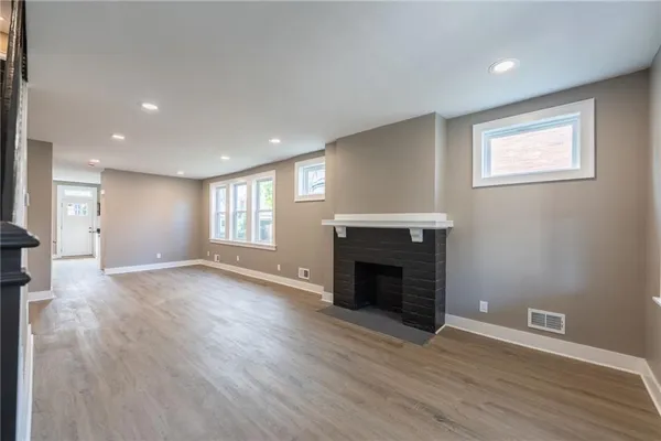 a view of an entryway with wooden floor