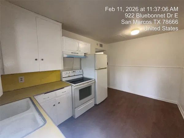 a kitchen with a stove and a refrigerator