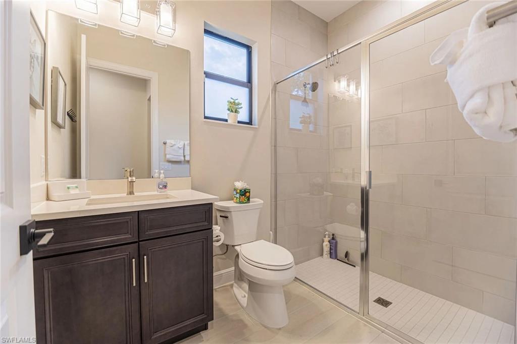 822 105th Avenue North Naples, FL 34108 - Photo 23 of 30 a bathroom with a sink toilet and shower