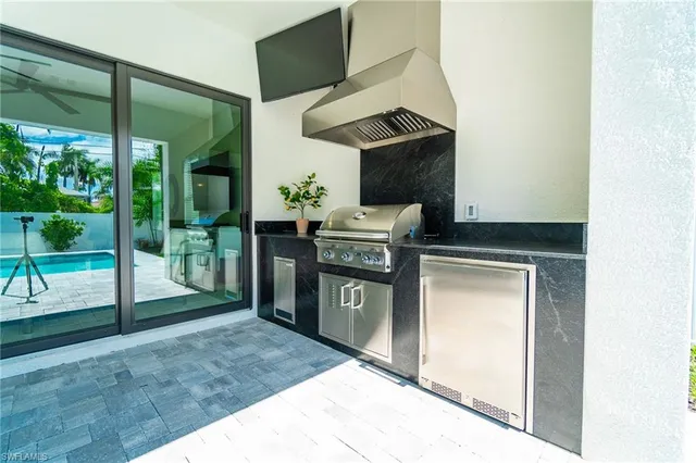 a kitchen with a stove and a shower