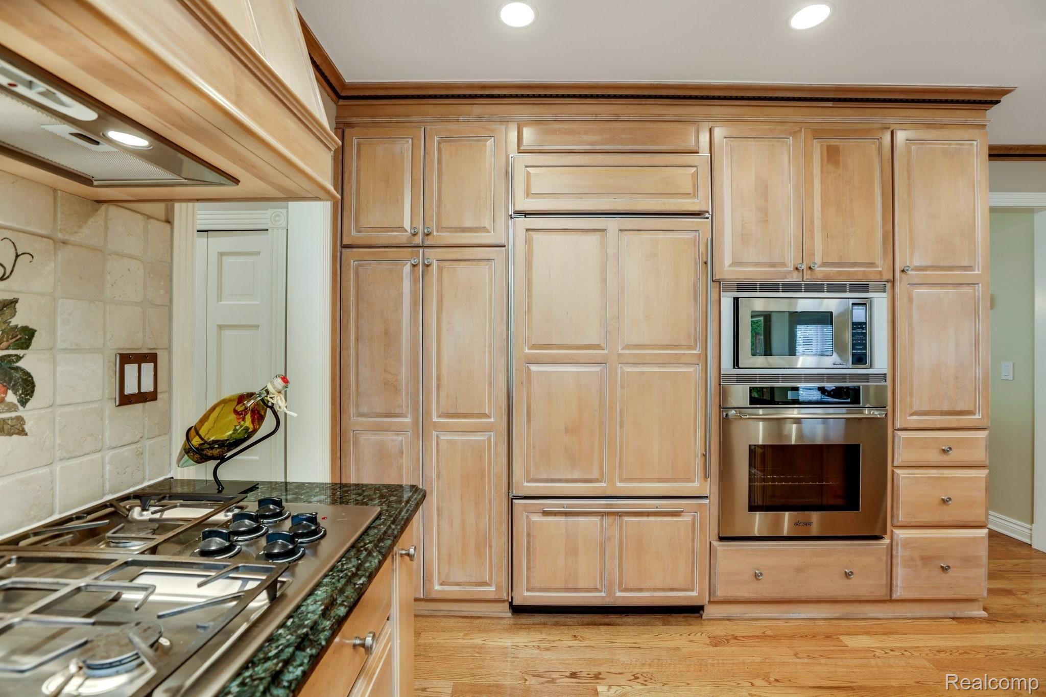 4808 Rivers Edge Drive Troy, MI 48098 - Photo 10 of 40 Built-in Sub-Zero refrigerator, gas Thermador range and stainless steel double ovens and microwave