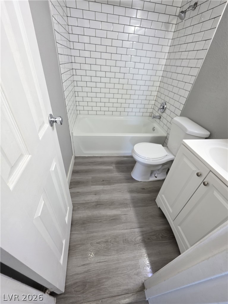 1089 East Desert Inn Road, Unit 3 Las Vegas, NV 89109 - Photo 13 of 15 Crisp white subway tile accents this clean, functional bathroom.