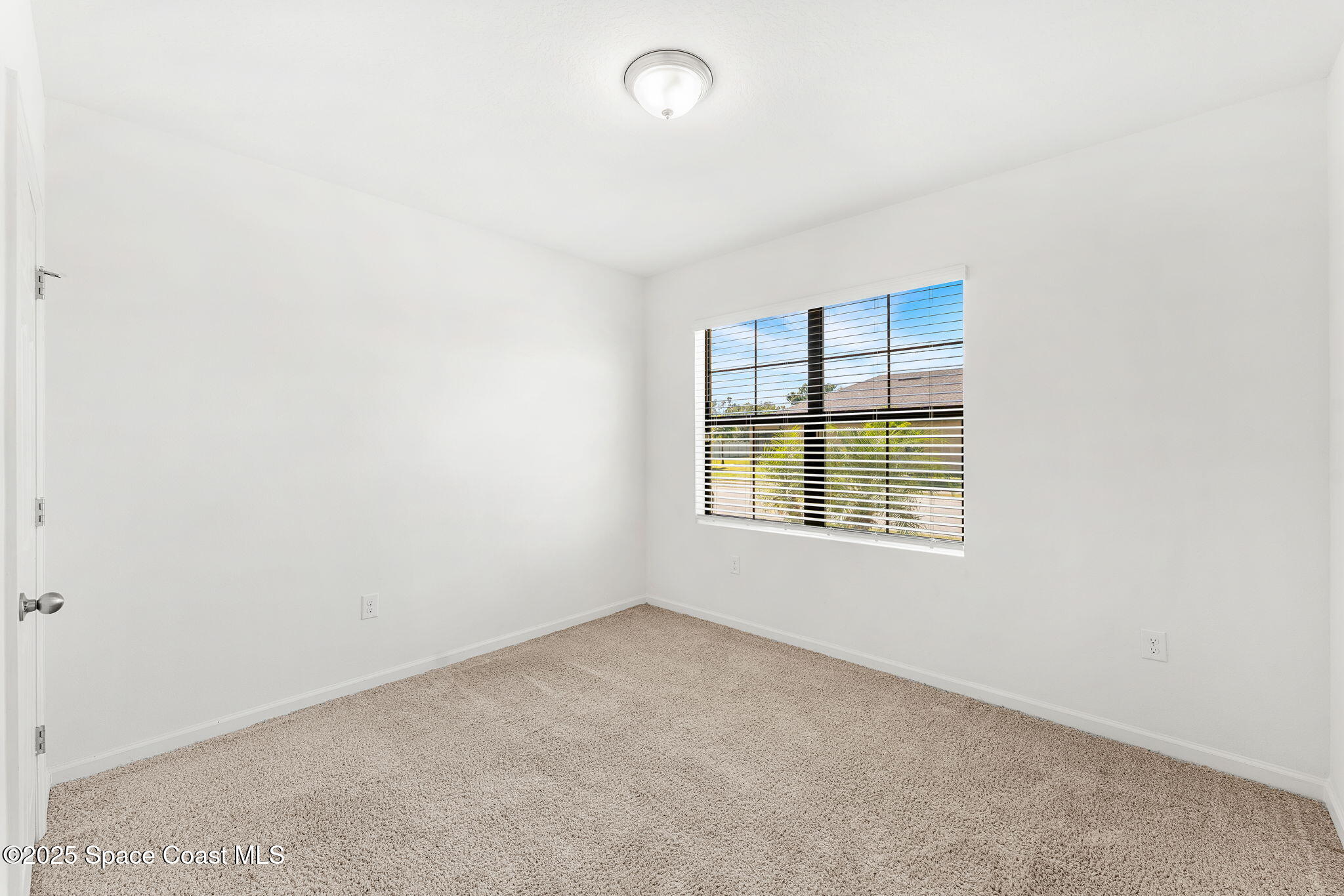 4667 Magenta Isles Drive Melbourne, FL 32904 - Photo 15 of 29 an empty room with a empty space and windows