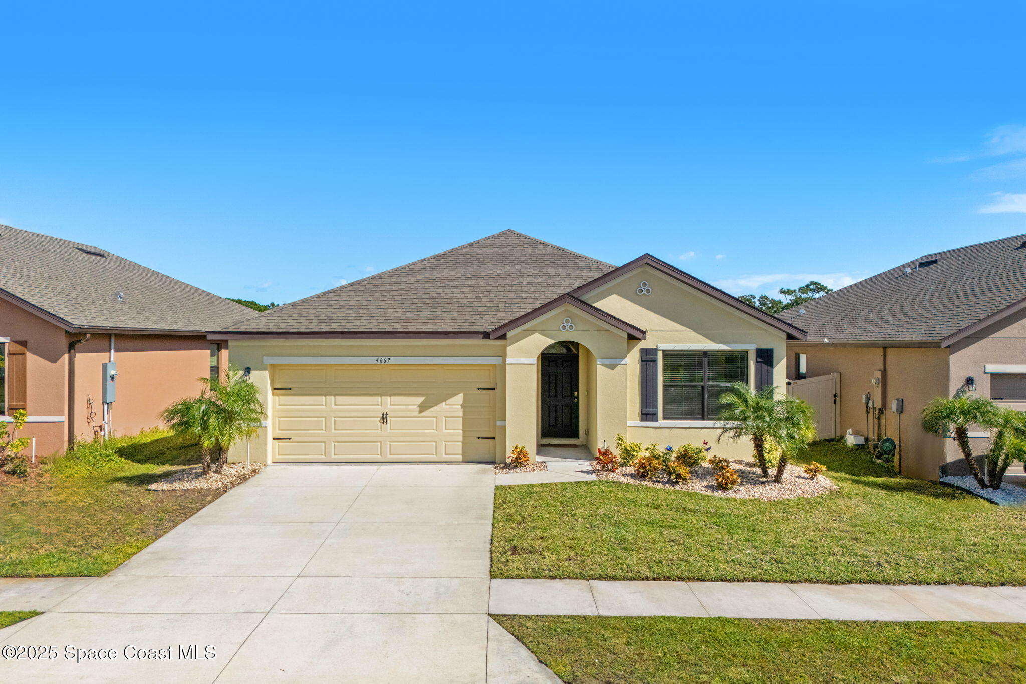 4667 Magenta Isles Drive Melbourne, FL 32904 - Photo 19 of 29 a front view of a house with a yard