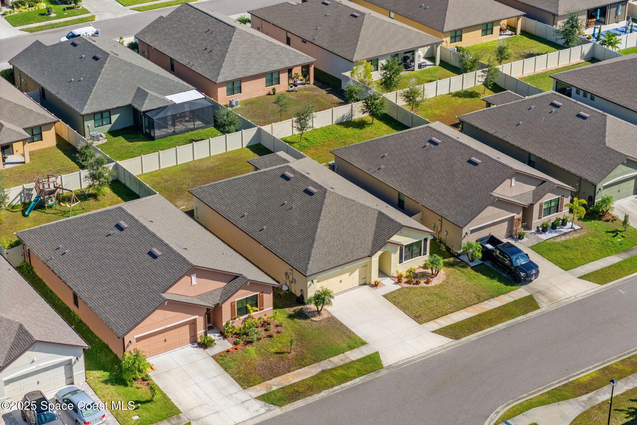 4667 Magenta Isles Drive Melbourne, FL 32904 - Photo 24 of 29 an aerial view of a house with garden space and street view