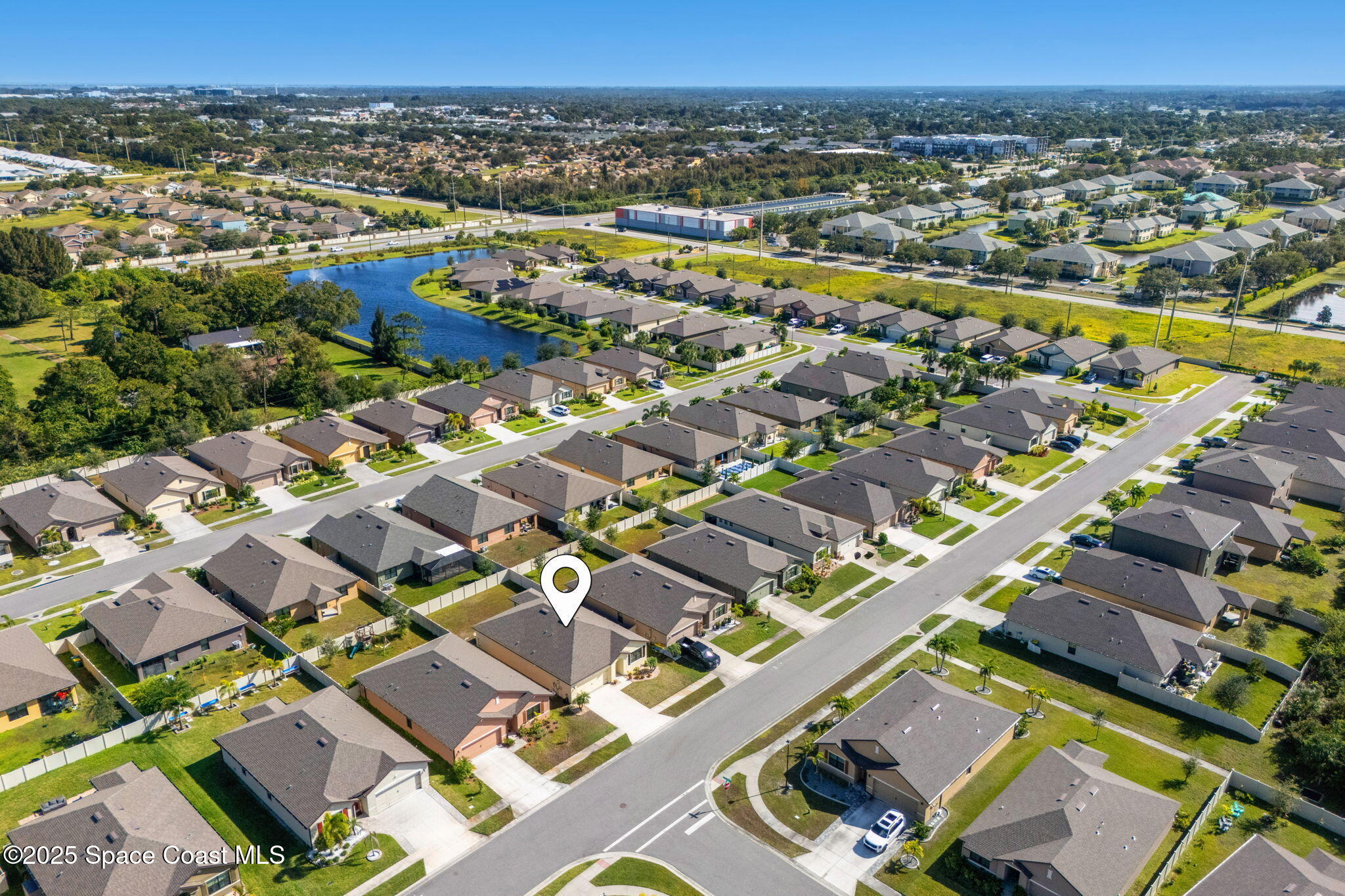 4667 Magenta Isles Drive Melbourne, FL 32904 - Photo 28 of 29 an aerial view of residential building with parking