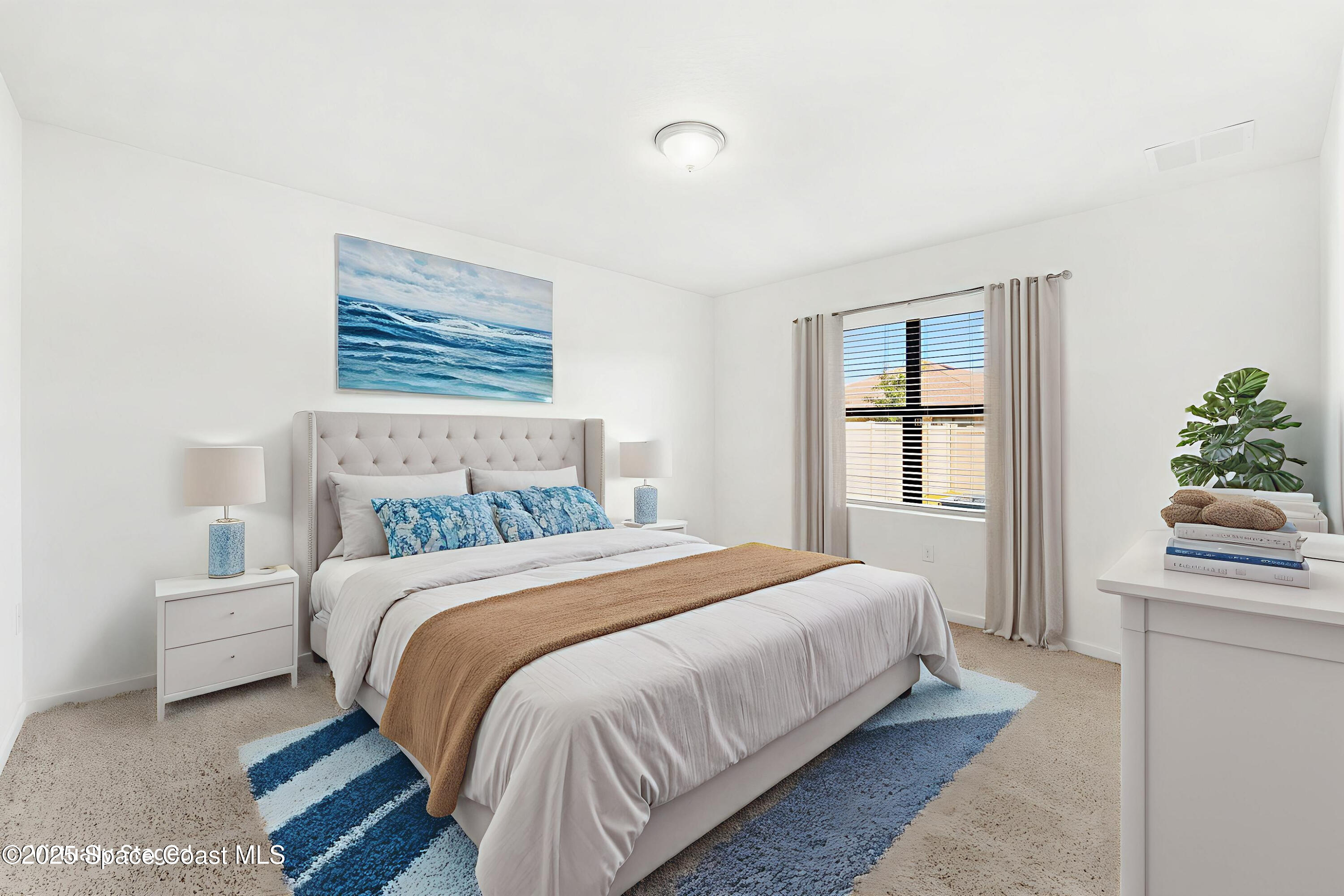 4667 Magenta Isles Drive Melbourne, FL 32904 - Photo 9 of 29 a bedroom with a bed and window