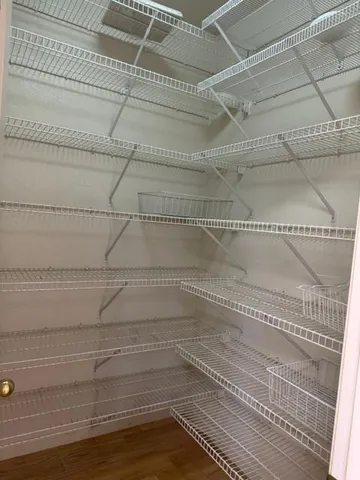 a view of a room with racks on the wall