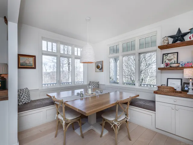 a dining room with furniture and window