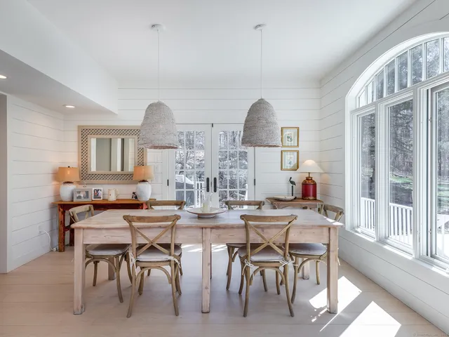 a view of a dining room with furniture window and outside view