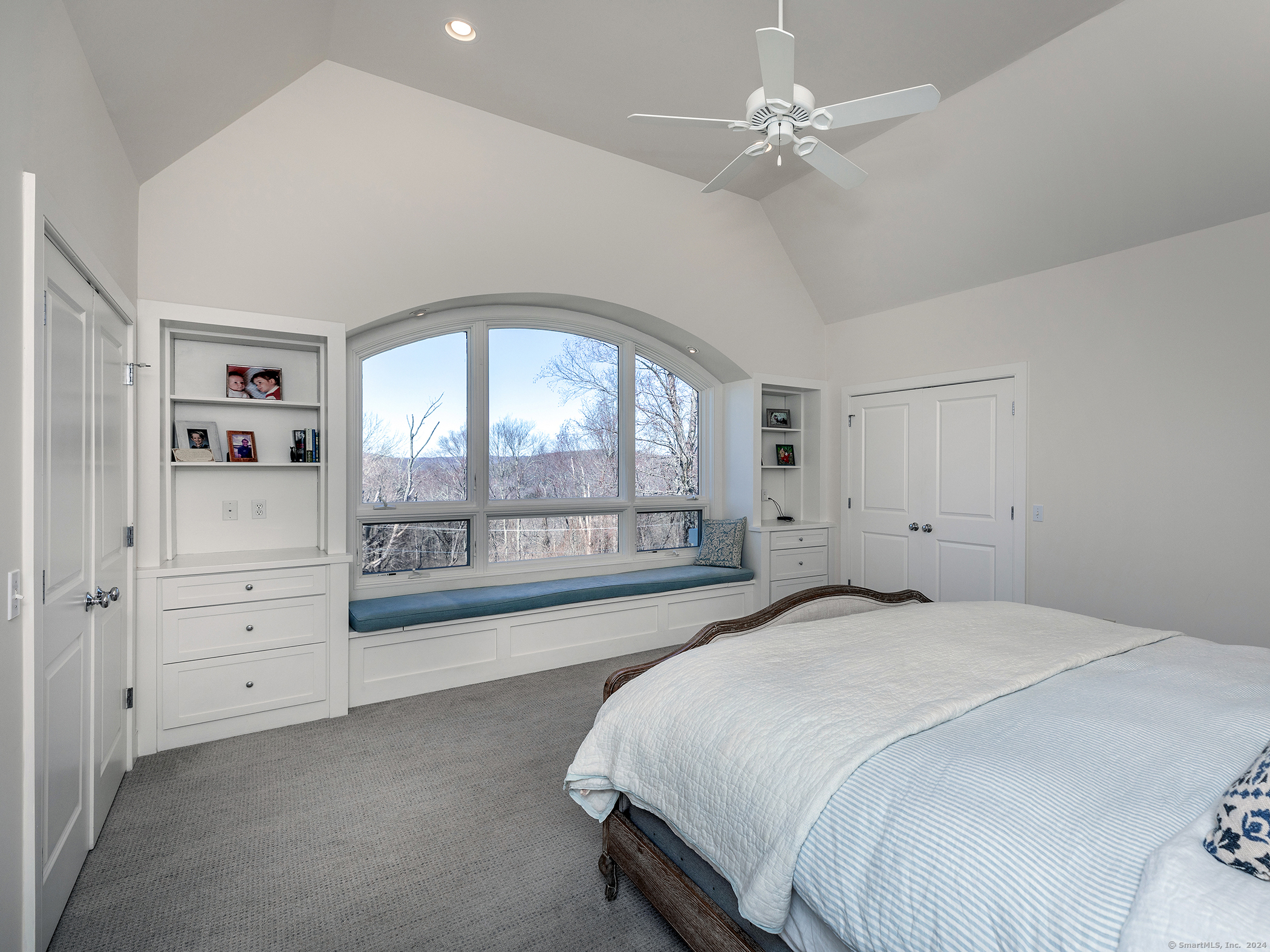 96 Kinney Hill Road New Preston Marble Dale, CT 06777 - Photo 17 of 36 a spacious bedroom with a large bed and a large window