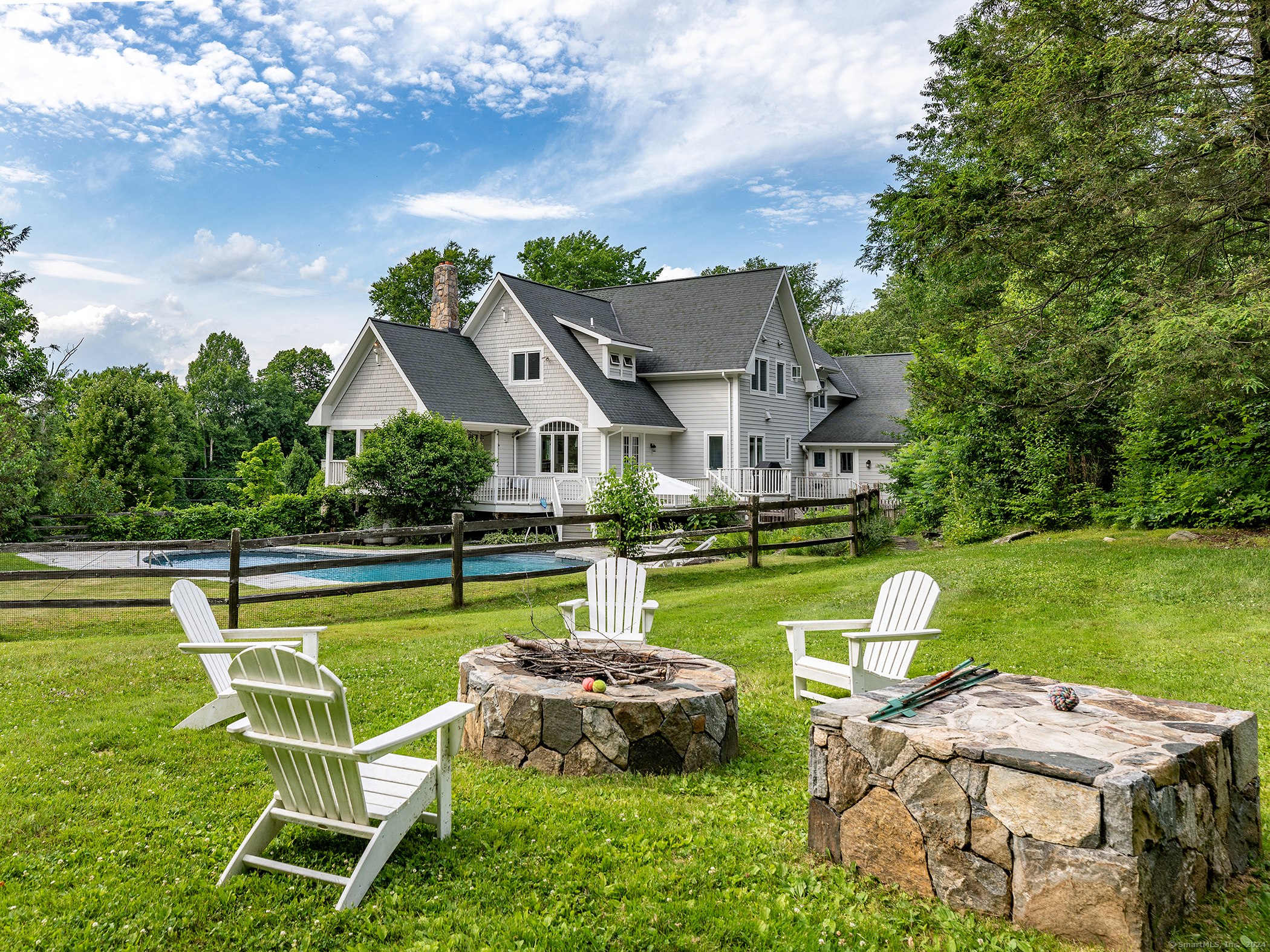 96 Kinney Hill Road New Preston Marble Dale, CT 06777 - Photo 3 of 36 a view of a swimming pool and lounge chairs in back yard of the house